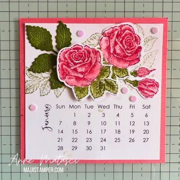A handmade calendar page for January with the pink roses and green leaves
